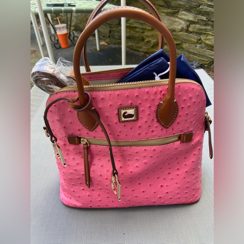 Brand new Dooney & Bourke satchel with shoulder straps.